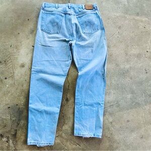 Vintage Wrangler light wash denim jeans w/ great distressing and fade 35” x 32”